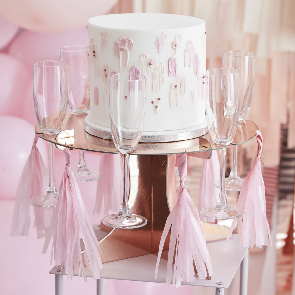 Tårtställ i rosa guld med champagnehållare