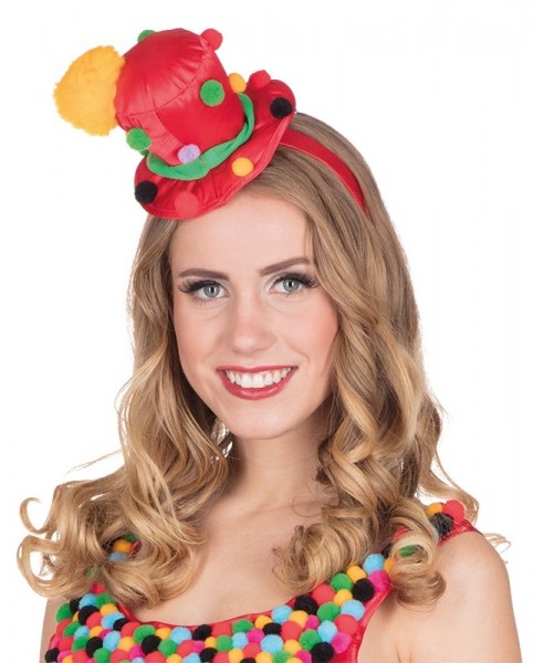 Diadema de payaso con sombrero de copa con pompones de colores