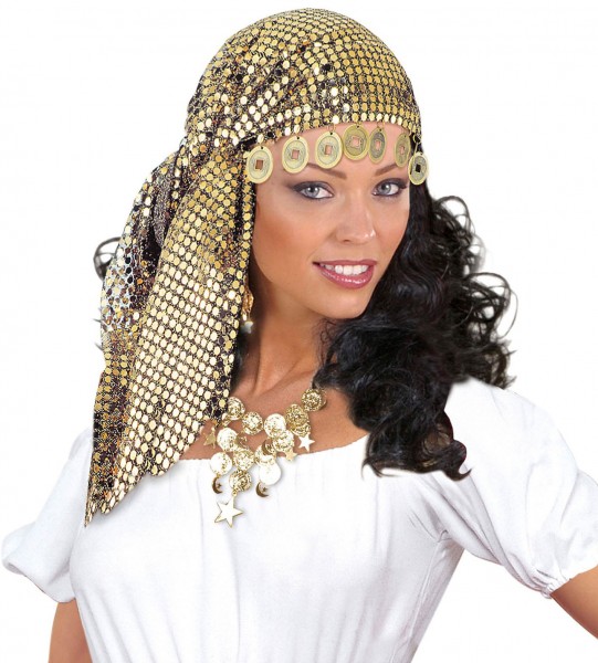 Fortune teller in sequin headscarf with coins