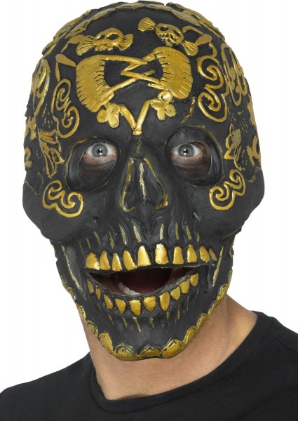 Czarna maska czaszki ze złotym ornamentem