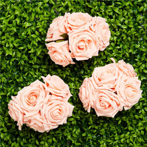 5 peach colored roses made of foam